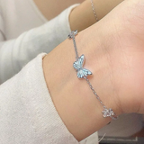 Set collana e bracciale con farfalla blu luminosa | Oro